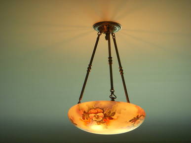 Historical touches such as this antique light were added throughout the home to give it a consistent period look.