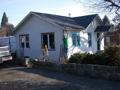 Removing old windows and trim.
