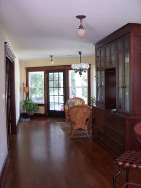 After: The old wet bar & wine rack were removed to make way for this new china cabinet & breakfast nook area.