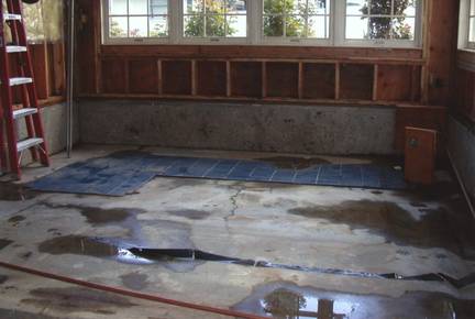Before: Demo work has begun on sunroom/hot tub area to transform it into a new kitchen.