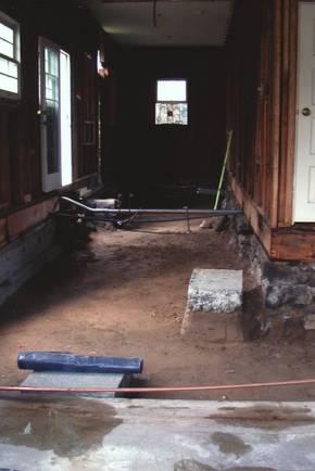 Before: Hallway leading to what would later be the new pantry and bathroom had to first be gutted to secure flooring and pipes that over time had degraded.