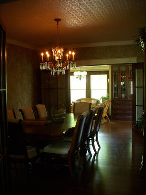 New Dining room featuring a faux tin ceiling & historic light fixtures