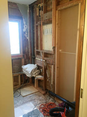 View from doorway with tub and wall removed.