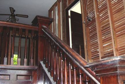 Before: Removal of the lath and plaster on the main stairwell.