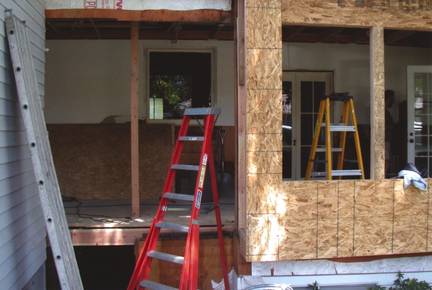 Before: wall beside the wet bar & wine rack was added onto to make room for the new breakfast nook.