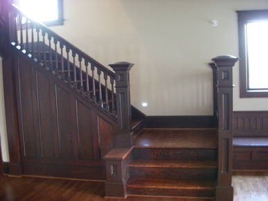 Main stairwell after some refinishing touches and new wall.