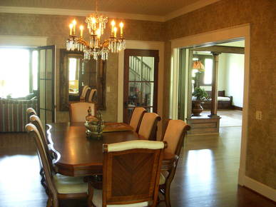 New completed dining room with new moldings, wall paper and faux tin ceiling. 