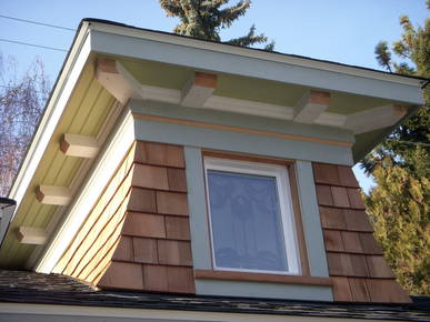 New dormer window featuring a call back to the stained glass inside the home.