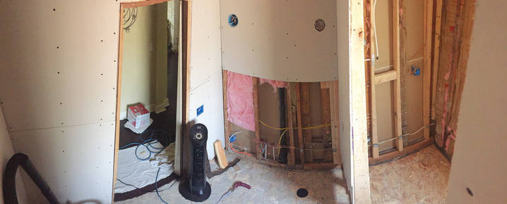 View towards vanity and shower as remodel continues.